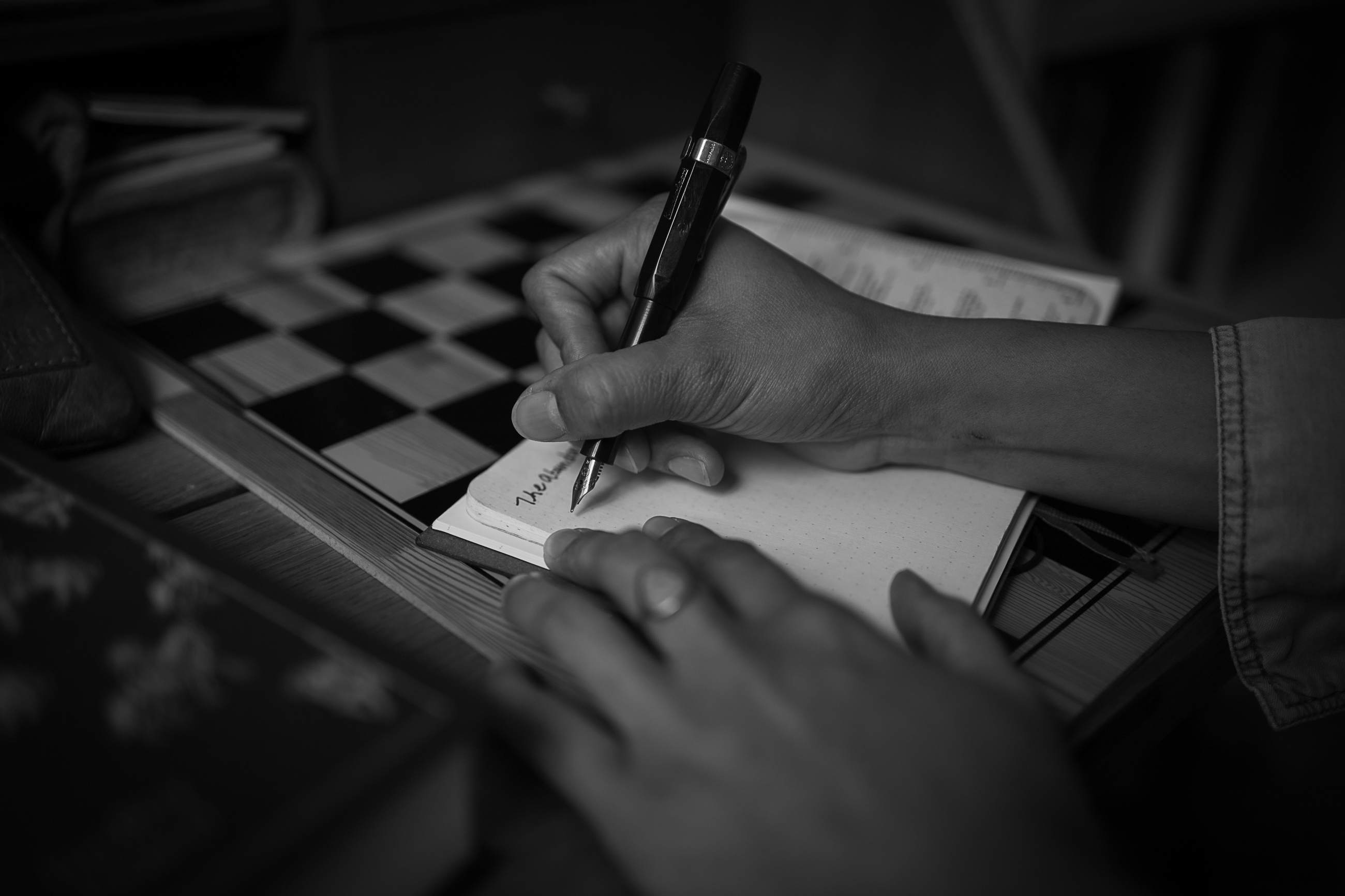 Jaclyn writing in a notebook.